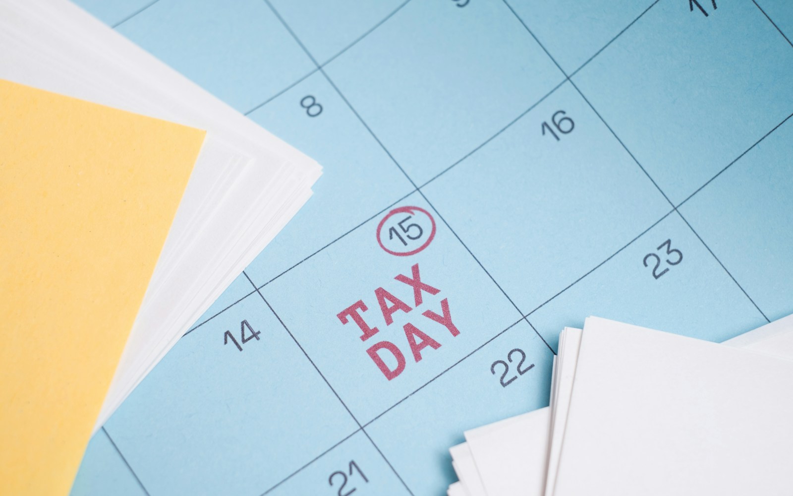 Calendar marked with "tax day" on the 15th.