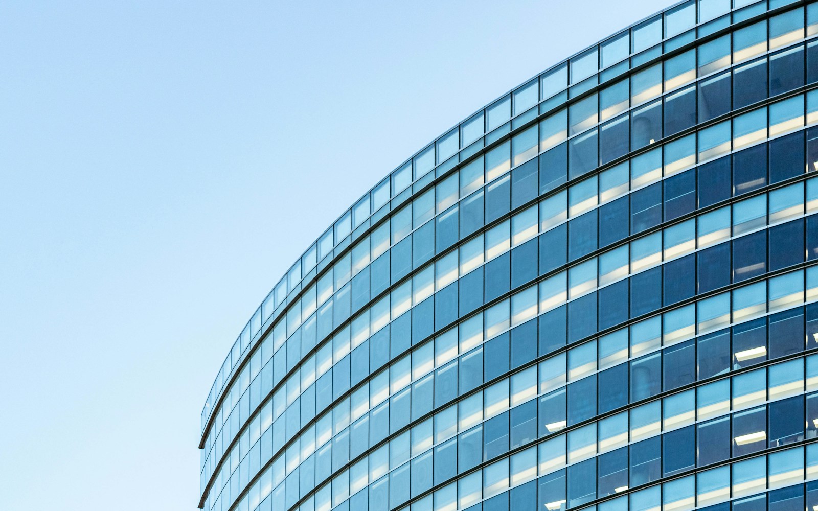 white and blue glass walled building