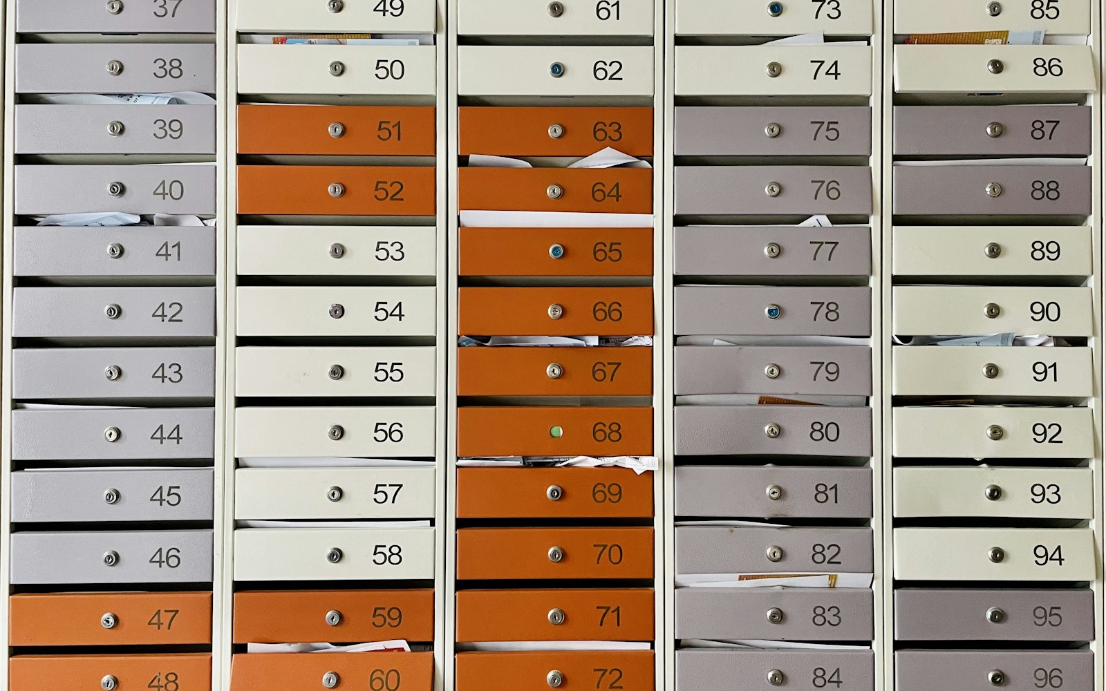 a bunch of mail boxes with numbers on them